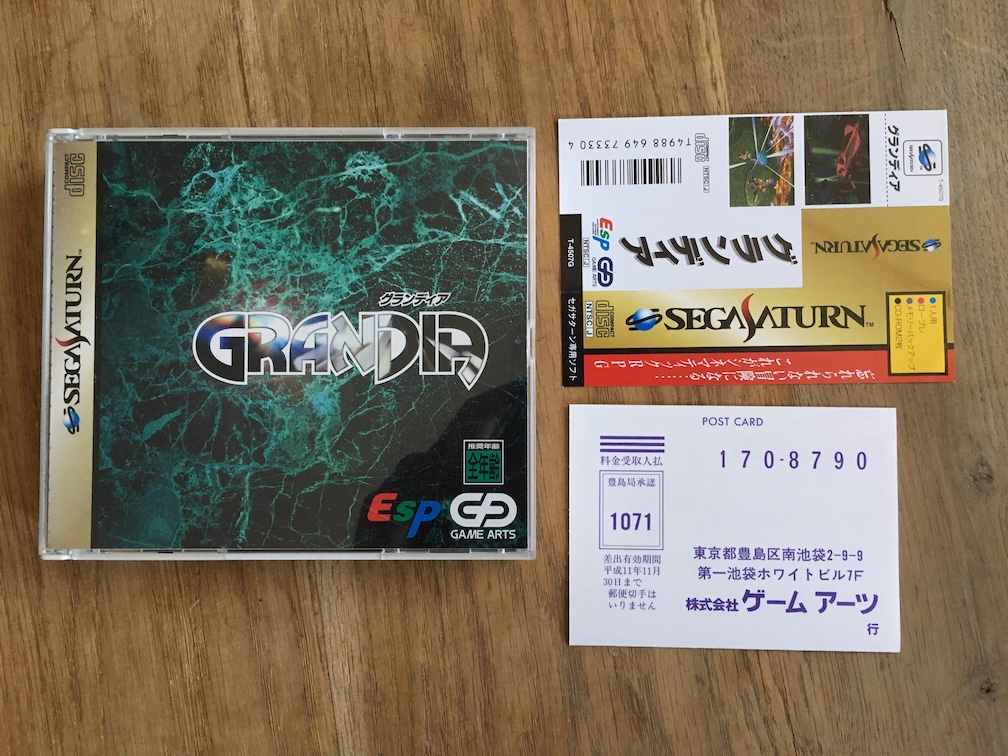 A picture of Grandia for the SEGA Saturn with the spine and registration card laid out